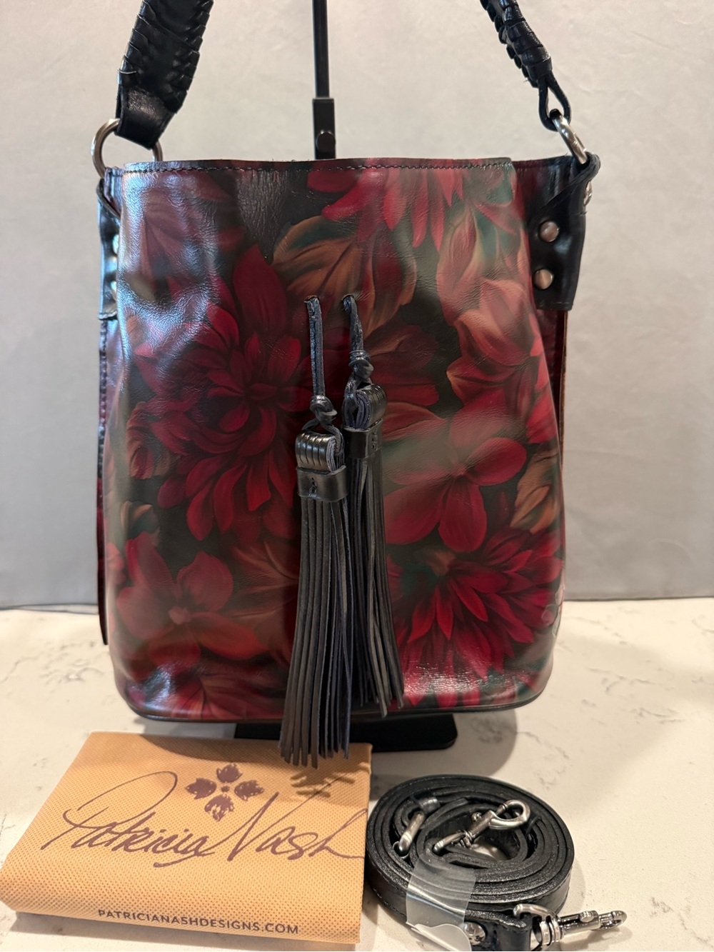 Patricia Nash Black and Red Floral Leather Bucket Bag with Tassel Strap